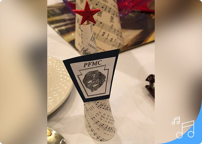 A close up of a paper cone with music notes